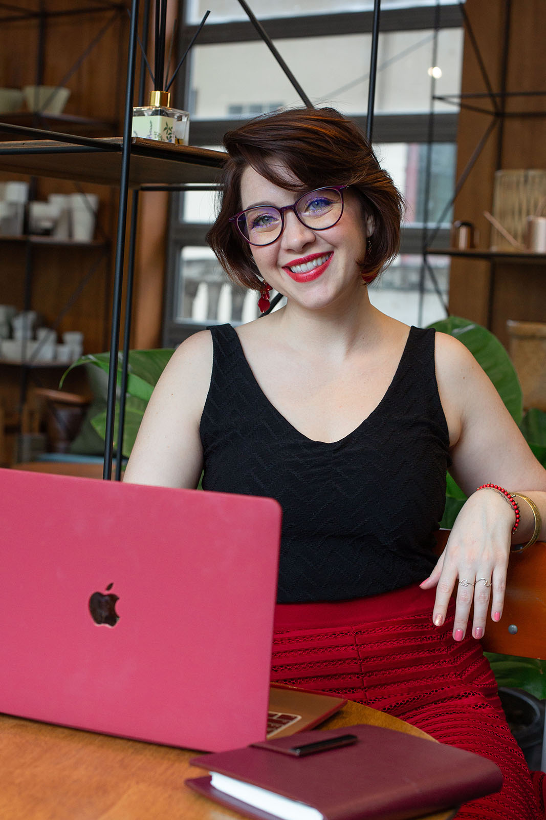 Susanna Nicol from eq for kidz sitting in front of her laptop